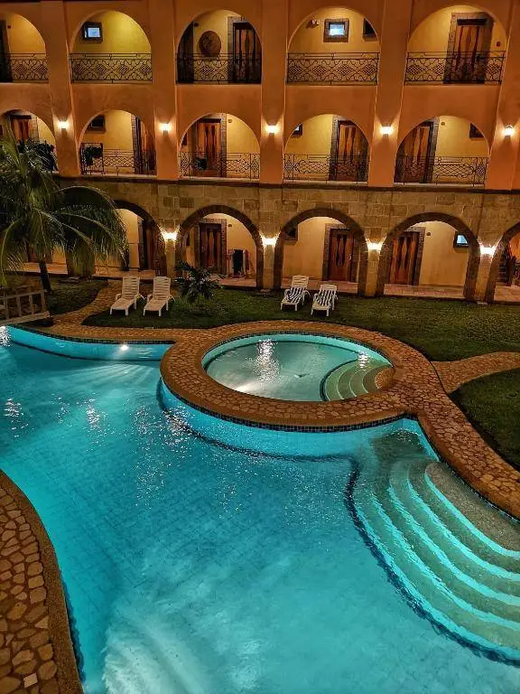 The pool and archways at a small hotel in Coron