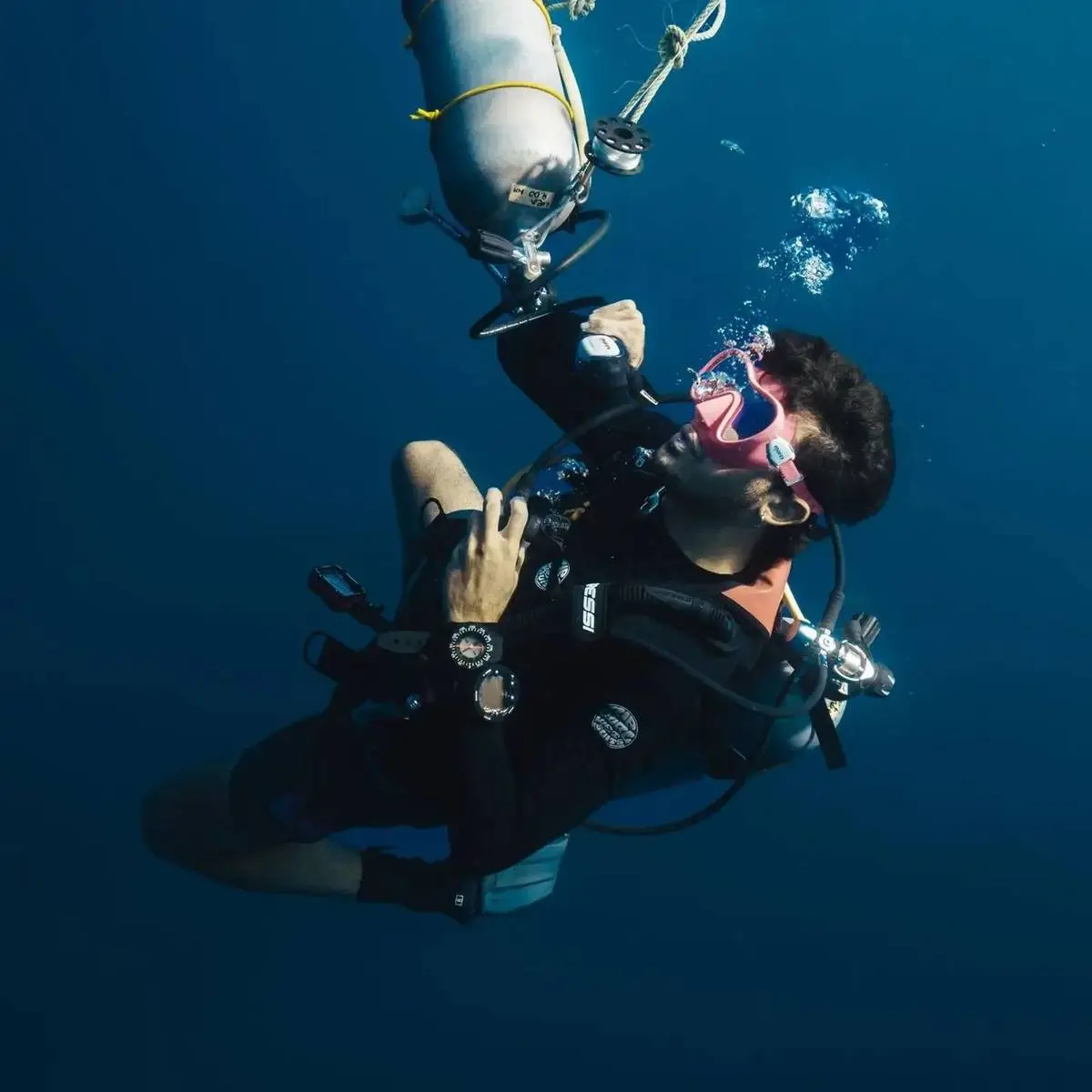 A diver descending into the blue off Gili Trawangan