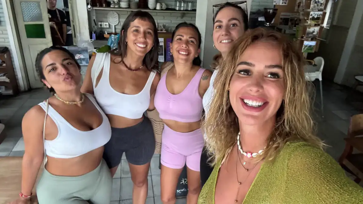 Guests laughing together in a kitchen after a morning on the water