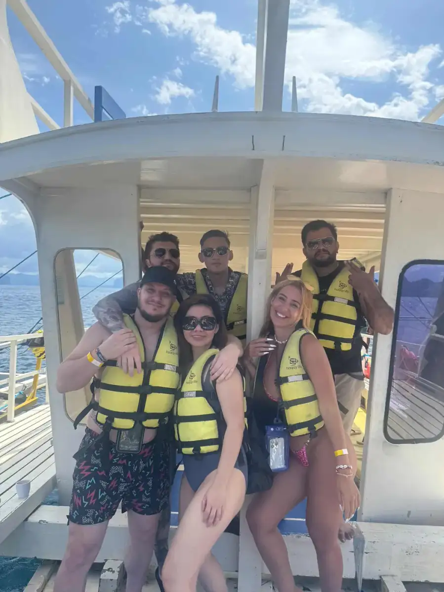 A group of guests in life jackets on the boat