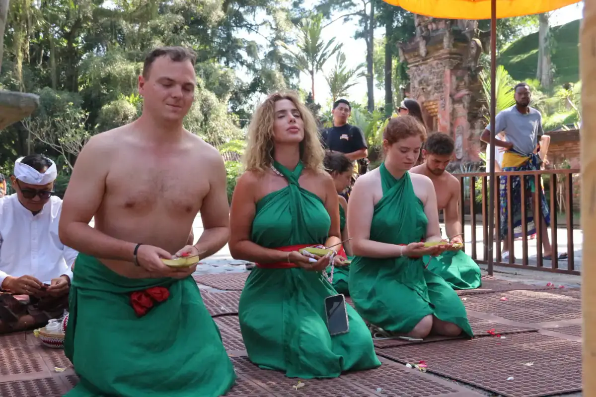 Guests wearing matching green sarongs together