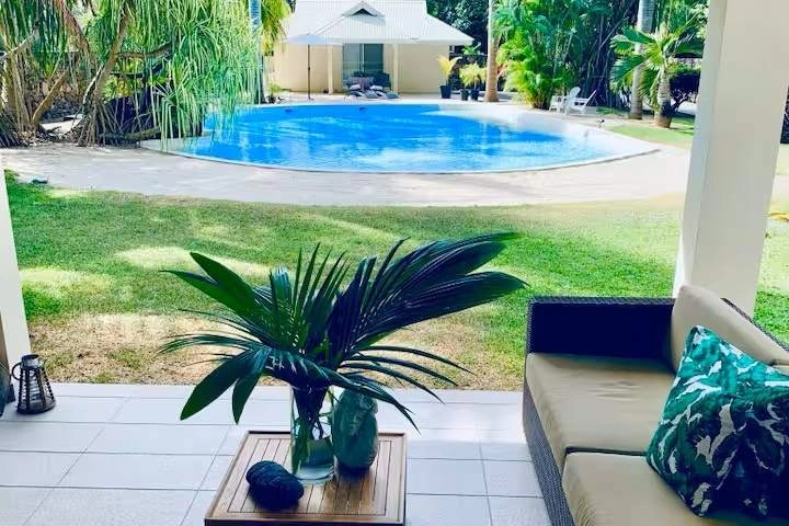 The covered veranda and pool at Villa Royal Palms