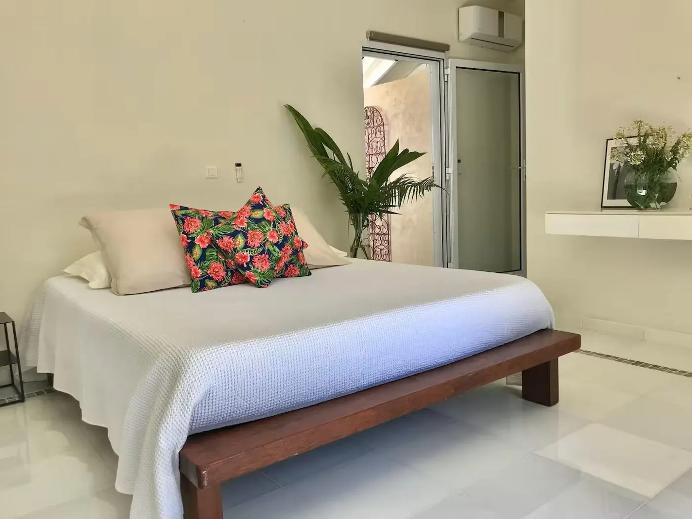 A villa bedroom with a double bed