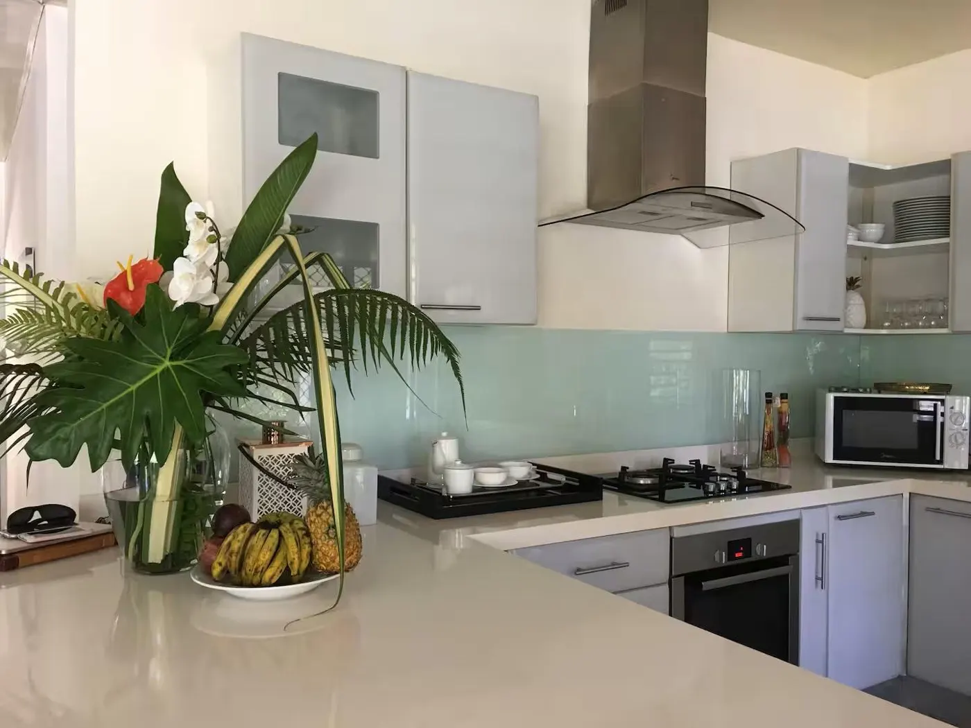 The villa kitchen with fresh flowers and fruit
