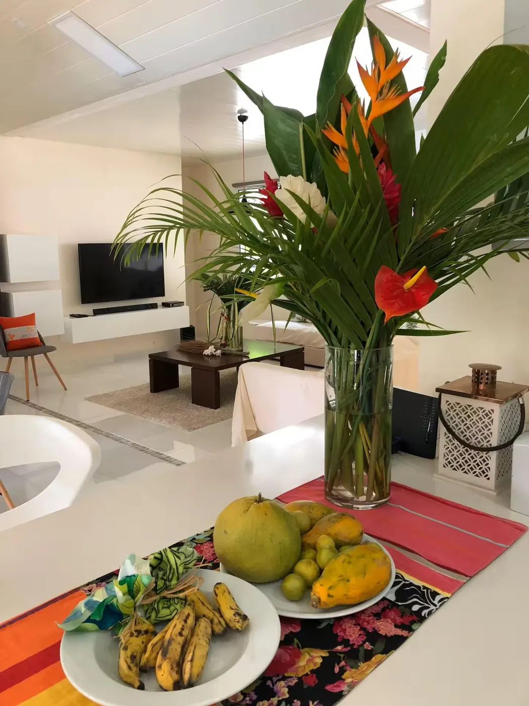 Tropical flowers and fruit on the villa table