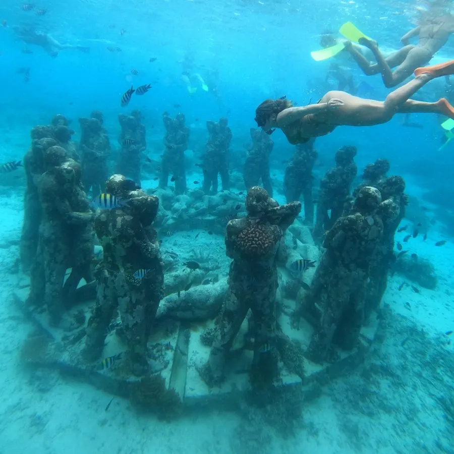 Freediving over the underwater statues in the Gili Islands